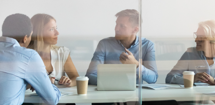 stock image of people at table talking